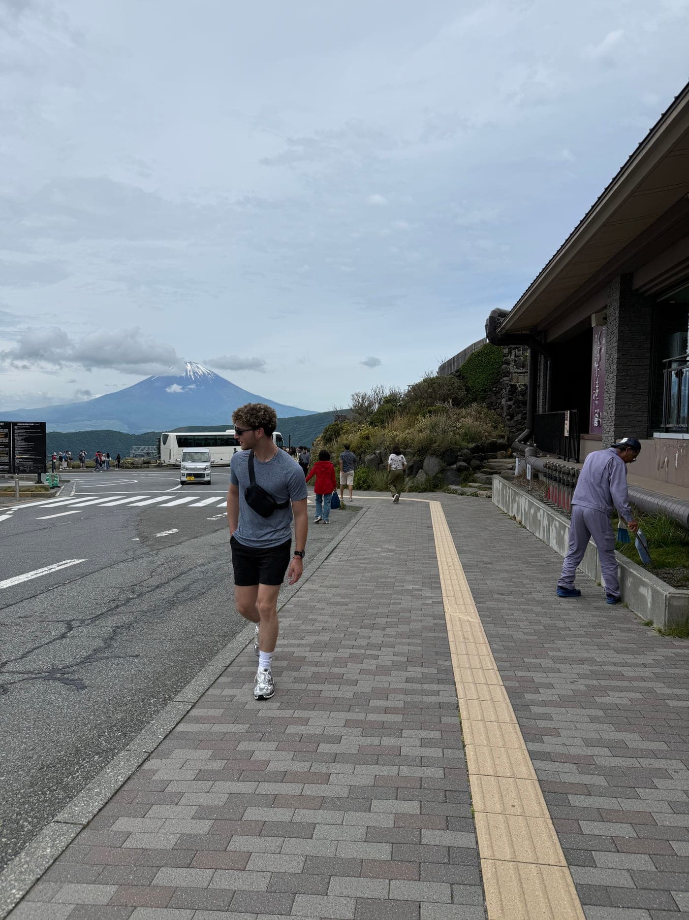 Josh in Hakone, Japan, with Mount Fuji behind him
